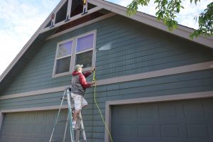 Campbells Custom Finishes Pressure washing a house in Bend Oregon